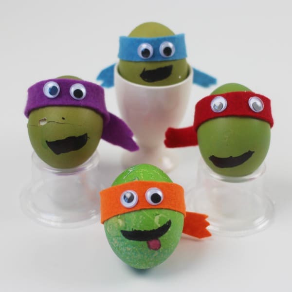 Teenage mutant ninja turtle decorated eggs. These TMNT eggs are totally cowabunga dude. Turn hard boiled eggs into heros in a half shell! The perfect Easter craft for kids.
