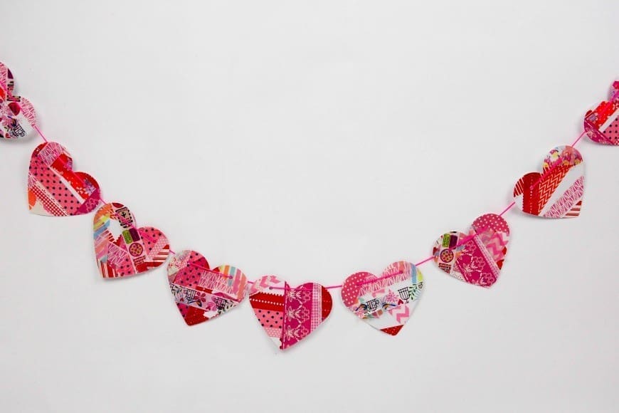 Washi Tape Hearts - Process Art for Preschoolers. This stunning kids craft is perfect for valentine's day, but it is also a great kids art activity and you can make a beautiful DIY heart garland with the upcycled artwork.
