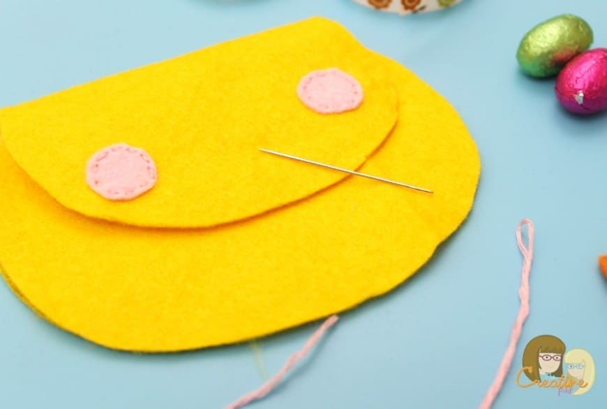 This cute felt chick purse is the perfect introduction in to sewing.  A simple DIY craft sewing project to hold your kids Easter eggs this Spring.  