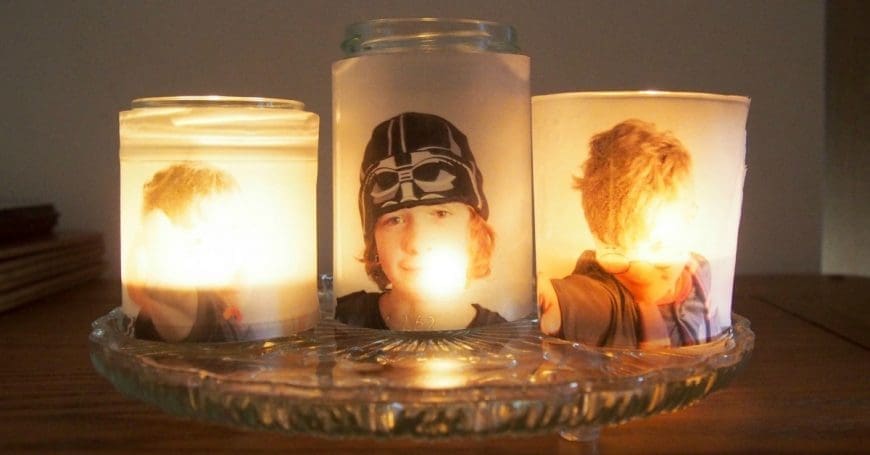 Upcycle glass jars into a stunning glowing photo jar luminaries. This beautiful photo luminaries glow when you add a candle and make the perfect gifts. What a fun DIY craft. 