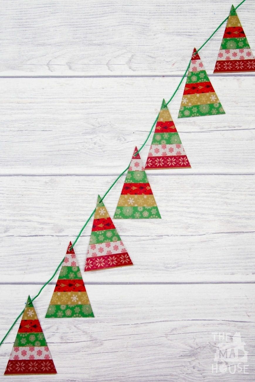 A simple Washi Tape Christmas Trees Garland. This is a super fun and simple kids craft perfect for the festive season using washi tape