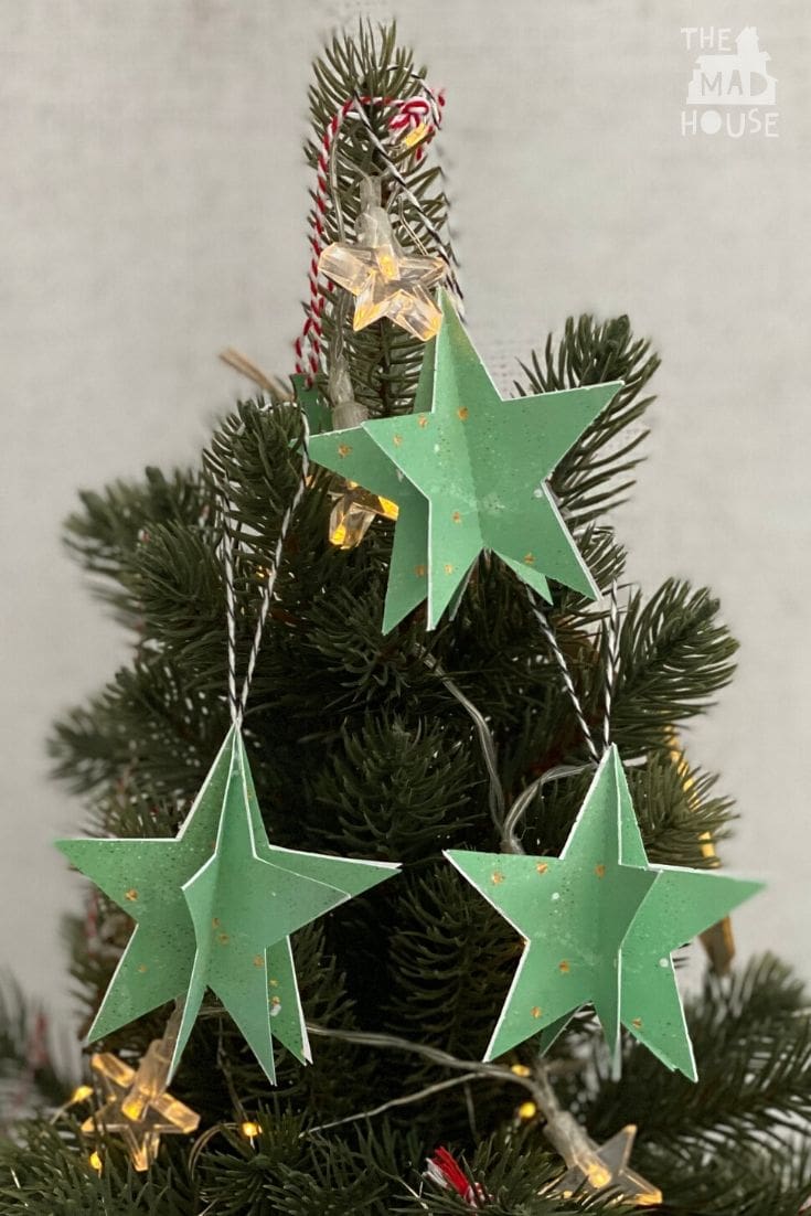 Use our Free Printable Christmas Star Ornaments with Templates to make beautiful DIY holiday tree decorations.  The Star Ornament template is designed to be easy to print, cut out, and use.