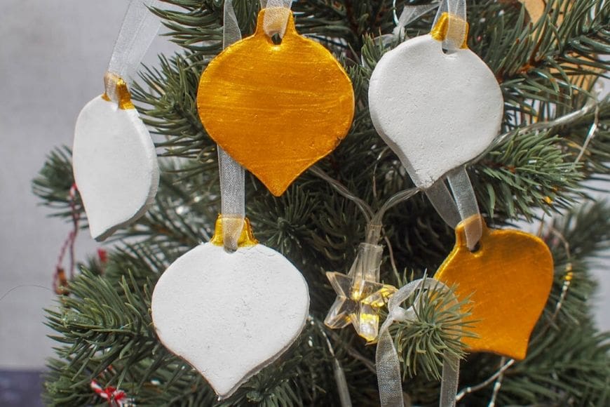 Gold and White Air Drying Clay Christmas Decorations on tree