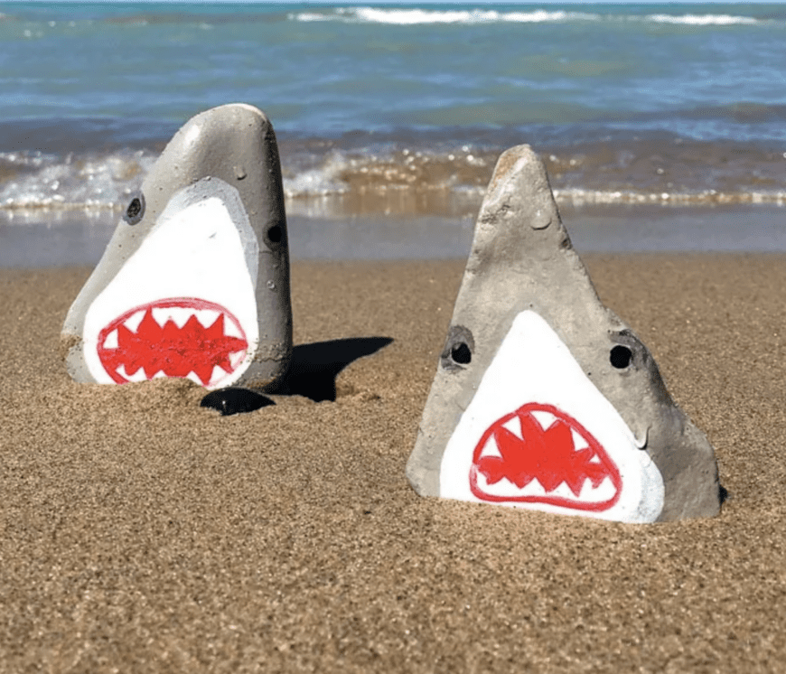 Rocks painted as sharks 