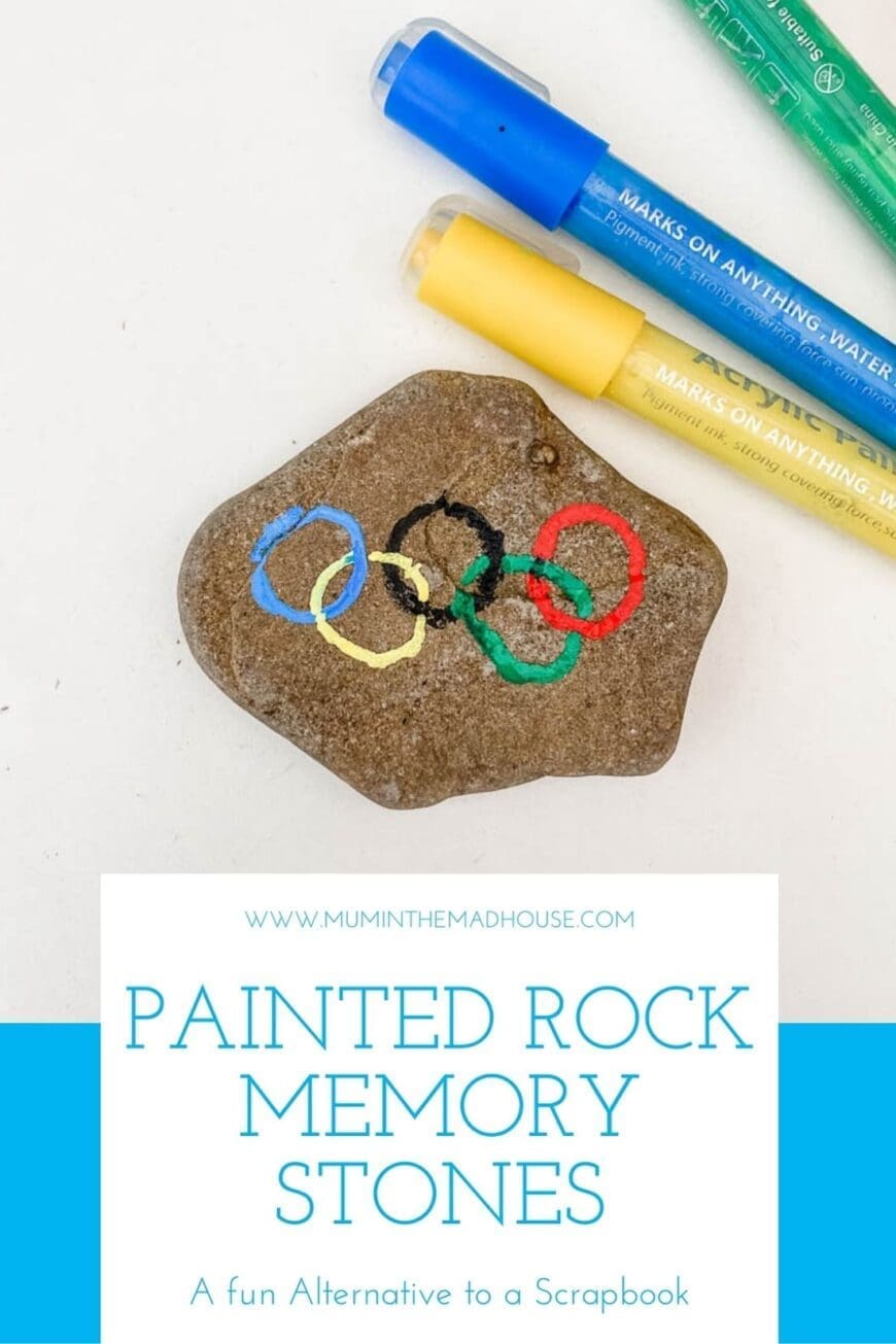 A rock with the olympic rings painted on 