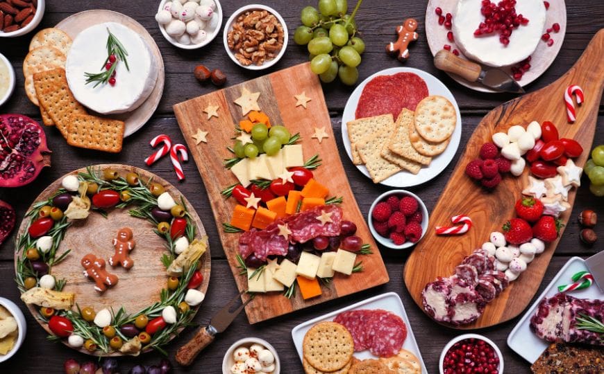 Eco-friendly Christmas snack board with seasonal fruits, cheese, and chutney